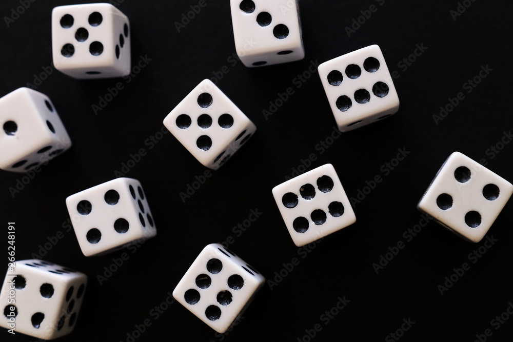 Rolling Dices over black background. Casino gambling concept Rolling Dices over black background. Casino gambling concept