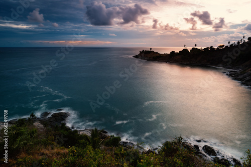 Beautiful seascape at laem promthep phuket in cloudy day ..Long exposure shot of sunset seashore and exotic twilight sky reflecting on blue sea at tropical island.