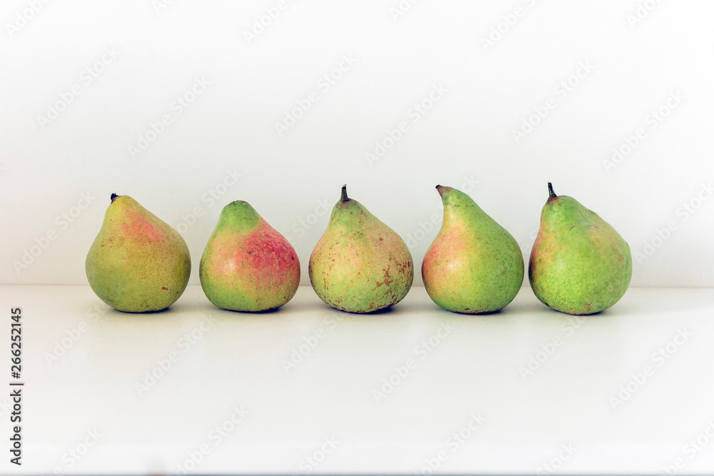 Fresh ripe pears on white background, vegetarian concept. Fresh ripe pears on white background, vegetarian concept.