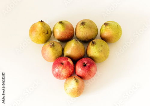 Fresh ripe pears and apples  on white background, vegetarian concept.