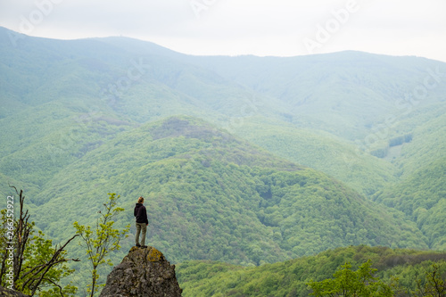 Girl standing on a cliff