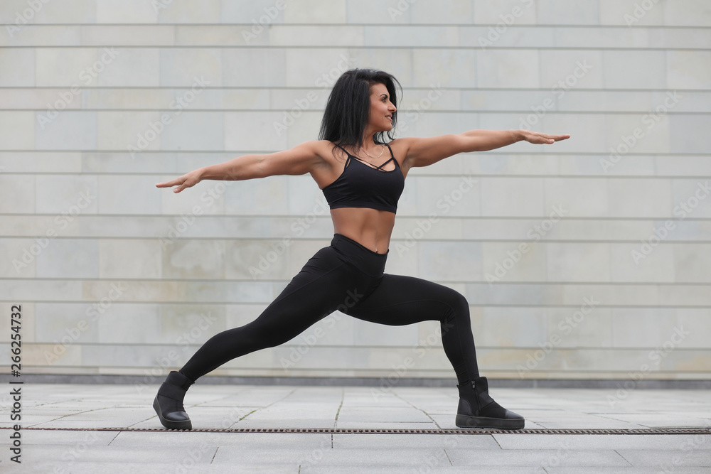 young strong muscular girl doing exercises