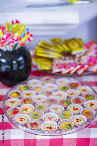 Hand made colorful mini tarts on the table.