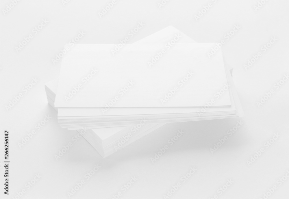 Mockup of business cards on white textured paper background Mockup of business cards on white textured paper background