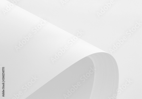 A4 blank paper stack with soft shadows isolated on white background