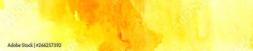 Texture of the paper, tinted with light and deep stains of yellow watercolor. Banner format