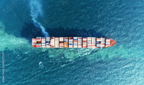 Aerial top view container ship full load container on the sea for logistics, import export, shipping or transportation.