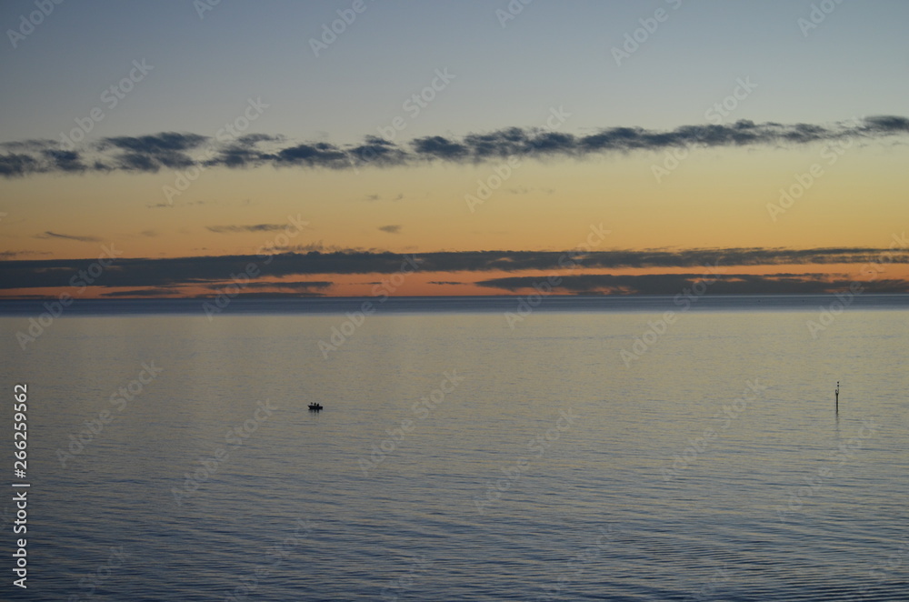 fishing boat in calm waters off the coast at Glenelg South Australia