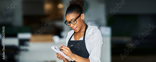 african american waitress taking order on notepad photo