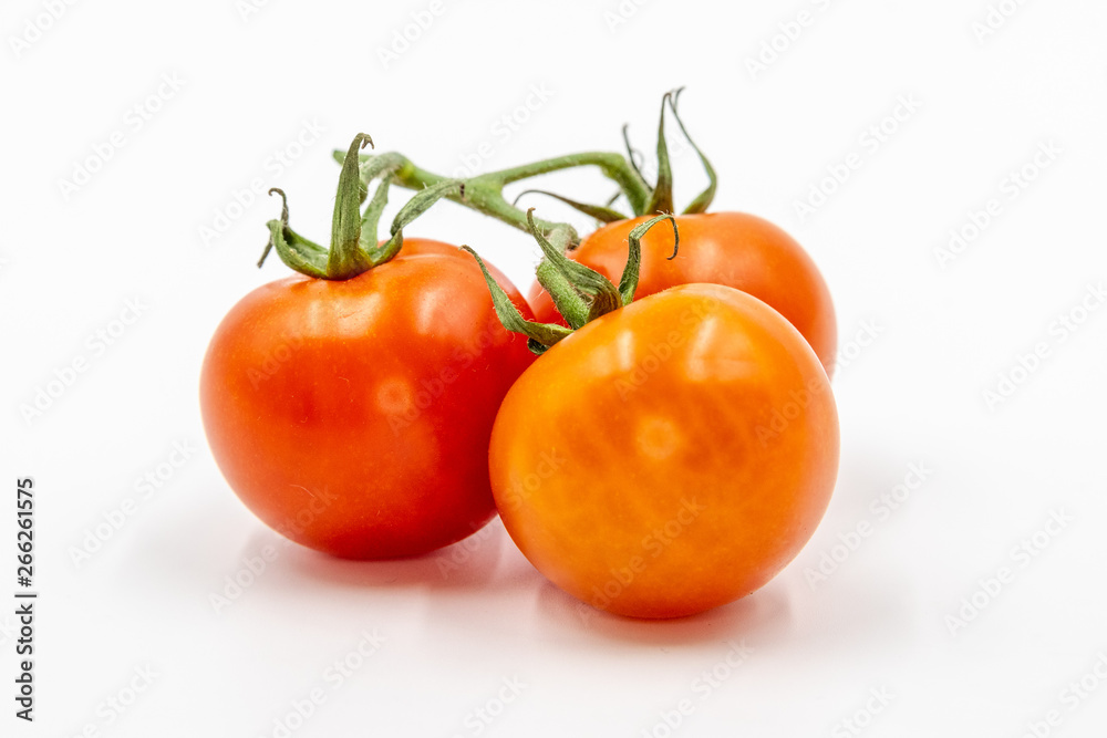 Three red tomatoes with branch Three red tomatoes with branch
