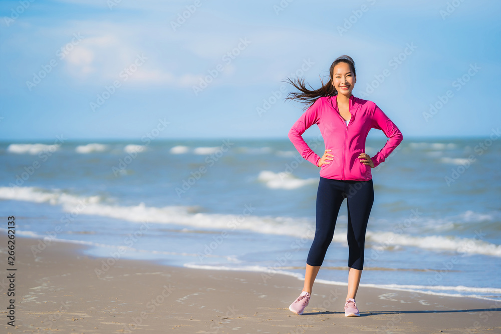 Portrait beautiful young asian woman running or exercise on the tropica nature landscape of beach Portrait beautiful young asian woman running or exercise on the tropica nature landscape of beach