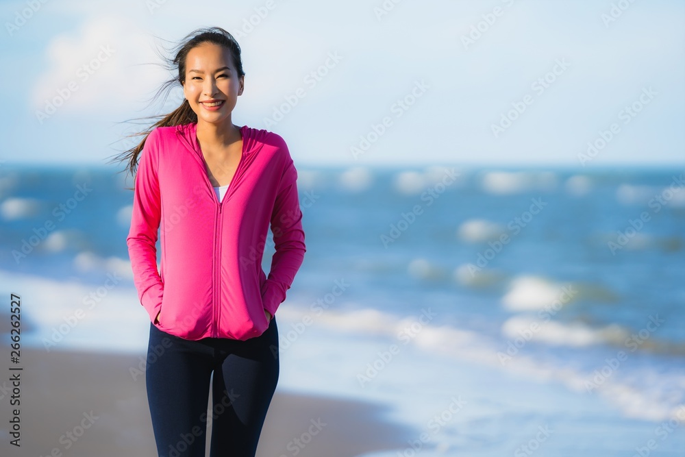 Portrait beautiful young asian woman running or exercise on the tropica nature landscape of beach Portrait beautiful young asian woman running or exercise on the tropica nature landscape of beach