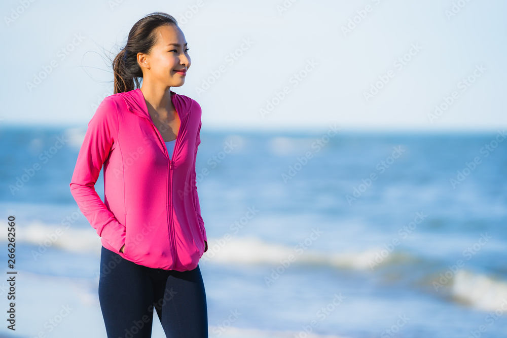 Portrait beautiful young asian woman running or exercise on the tropica nature landscape of beach Portrait beautiful young asian woman running or exercise on the tropica nature landscape of beach