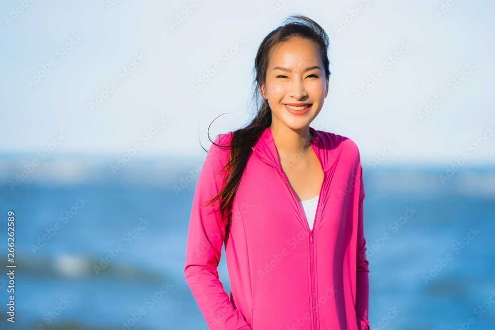 Portrait beautiful young asian woman running or exercise on the tropica nature landscape of beach Portrait beautiful young asian woman running or exercise on the tropica nature landscape of beach