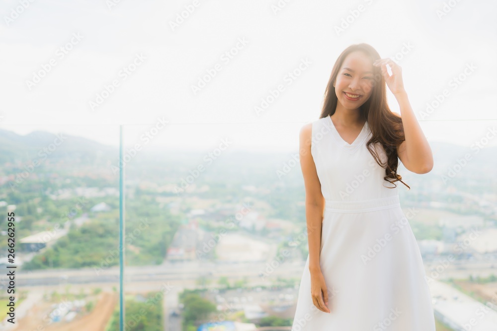 Portrait beautiful young asian woman smile happy and feel free with outdoor background