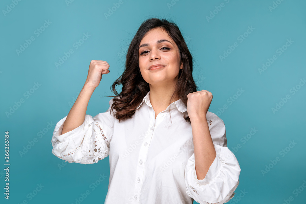 Happy woman on a blue background looking exited Happy woman on a blue background looking exited