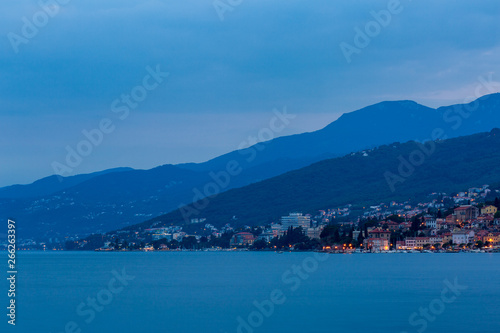 Blue evening on the sea, view to the town