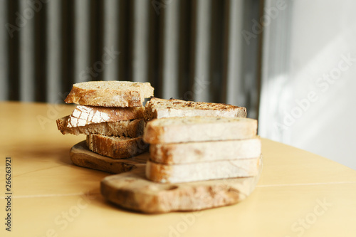 Pile of bread lying on the table with copyspace