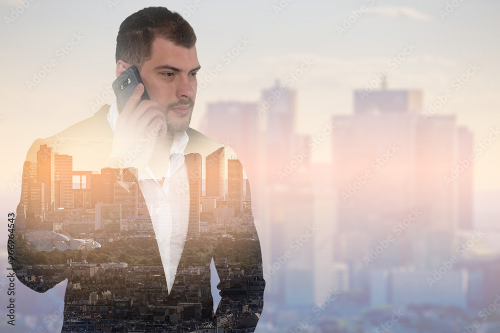 Double exposure image of businessman with smartphone on cityscape background Double exposure image of businessman with smartphone on cityscape background
