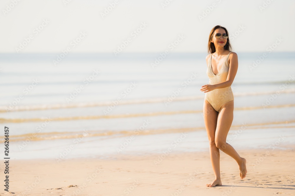 Portrait beautiful young asian woman smile happy walk on the tropical outdoor nature beach sea Portrait beautiful young asian woman smile happy walk on the tropical outdoor nature beach sea