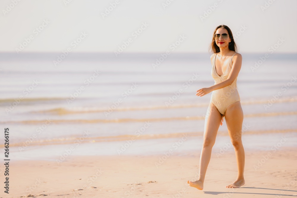 Portrait beautiful young asian woman smile happy walk on the tropical outdoor nature beach sea Portrait beautiful young asian woman smile happy walk on the tropical outdoor nature beach sea