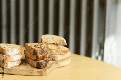 Pile of bread lying on the table with copyspace