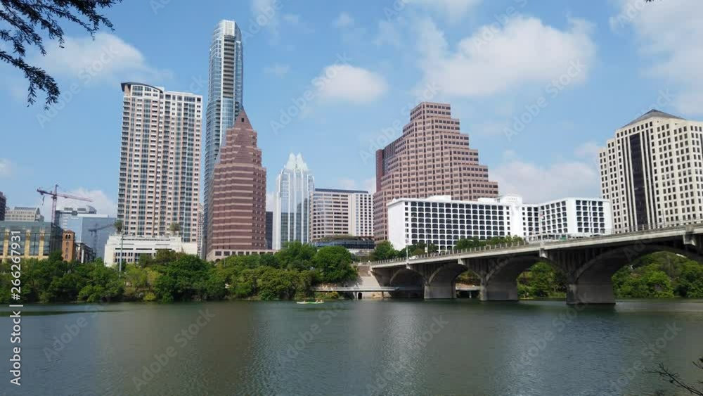 The beautiful skyline of Austin Texas and the Colorado River on a sunny day The beautiful skyline of Austin Texas and the Colorado River on a sunny day