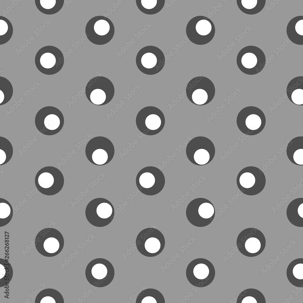 Polka dot abstract seamless pattern on a grey background