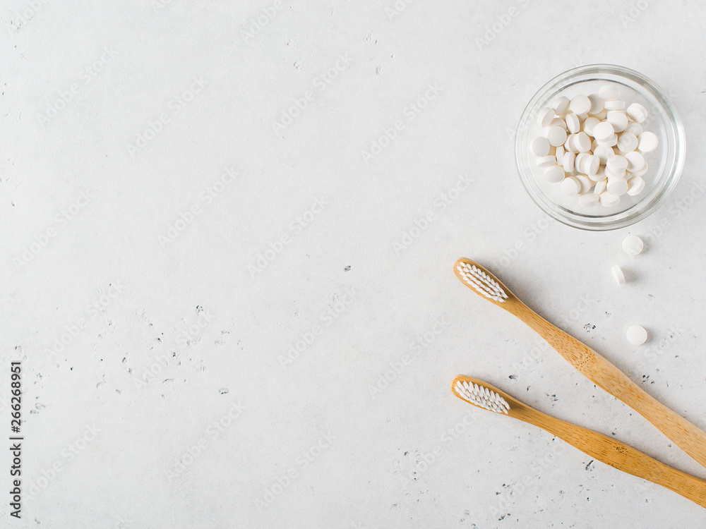 Zero waste and minimalism concept. Wooden ecological toothbrushes on white background Zero waste and minimalism concept. Wooden ecological toothbrushes on white background