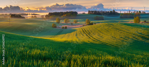 Canvas Print panorama of a beautiful, ecological farmland at sunrise