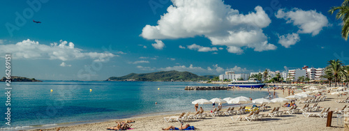 Panoramic image people sunbathing on Ibiza coast, Spain