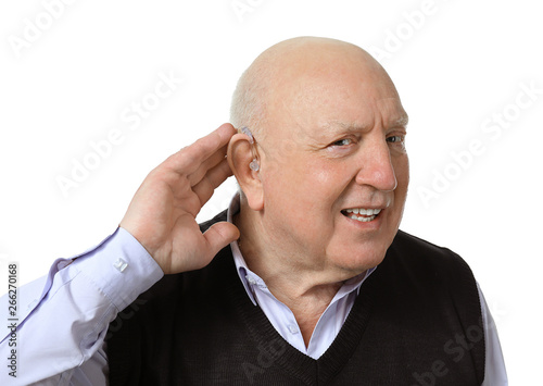 Senior man with hearing aid...