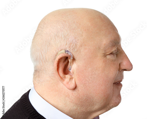 Senior man with hearing aid...