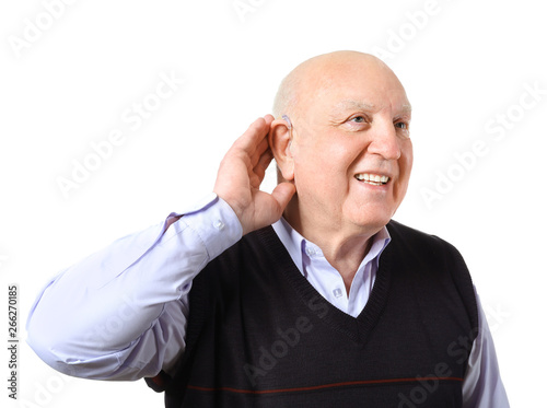 Senior man with hearing aid...