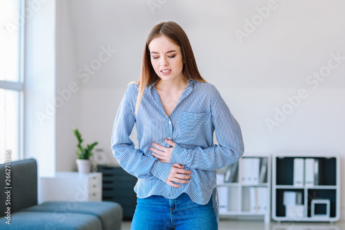 Woman suffering from stomac...