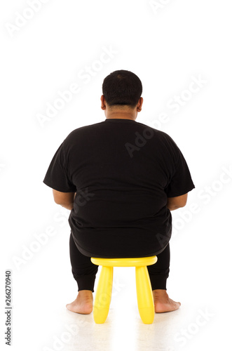 Back of obesity man on a chair isolated on white background