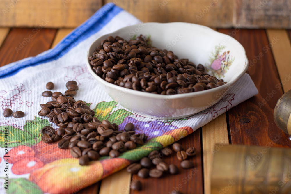 Coffee ready to be milled with old grinder Coffee ready to be milled with old grinder
