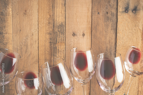 Flat lay red wine in glasses on wooden background with space, Concept of wine distillation, winery, winery, wine bar, party photo