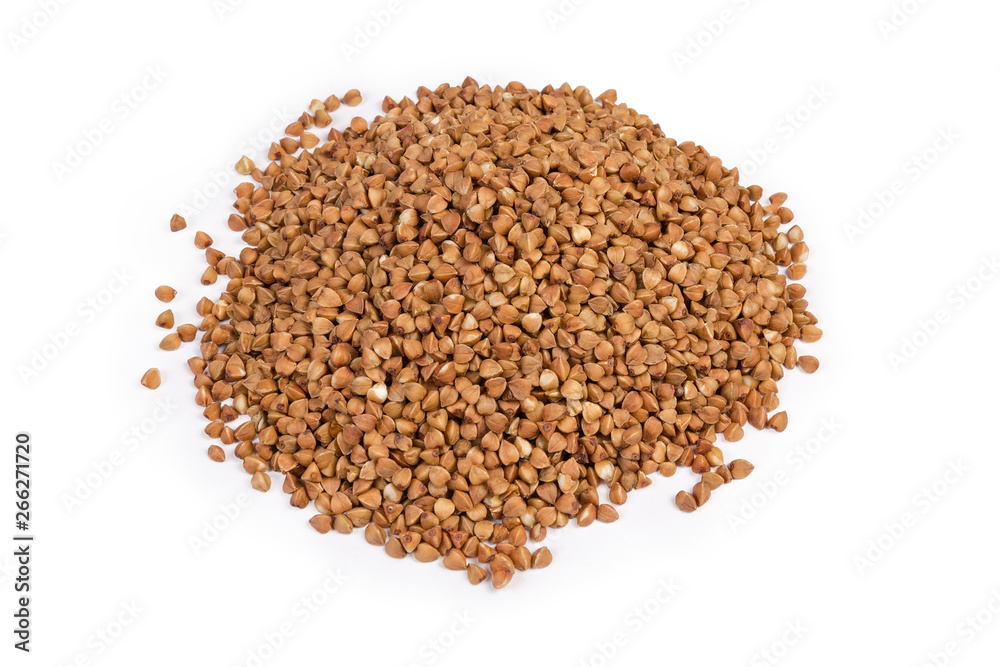 Pile of uncooked pre-steamed buckwheat groats on white background Pile of uncooked pre-steamed buckwheat groats on white background