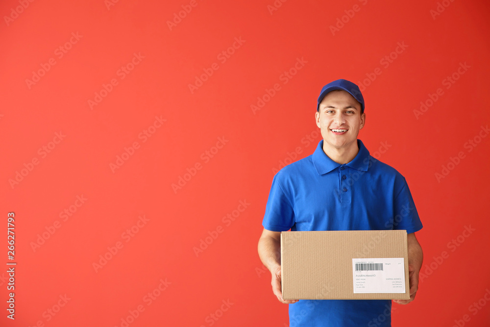 Delivery man with box on color background Delivery man with box on color background