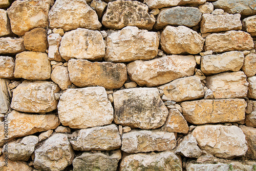 Texture of large cobblestones. Stone wall