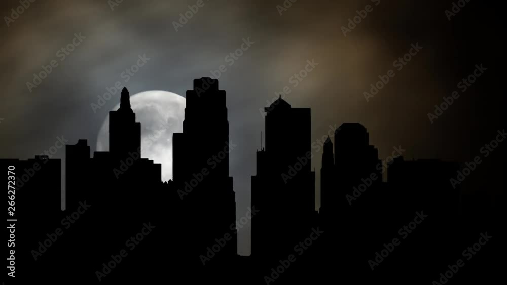 Kansas City skyline By Night with Full Moon, Clouds and Skyscrapers in Silhouette, Missouri, United State Kansas City skyline By Night with Full Moon, Clouds and Skyscrapers in Silhouette, Missouri, United State