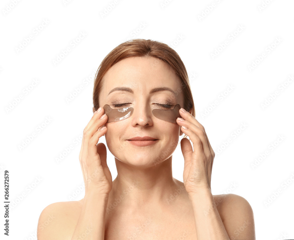 Mature woman with under-eye patches on white background Mature woman with under-eye patches on white background