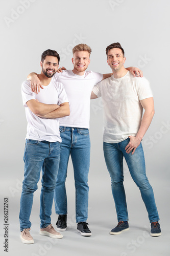 Handsome young men on light...