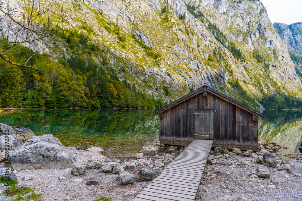 Wooden old houses on the lake Obersee, Koenigssee, Konigsee, Berchtesgaden National Park, Bavaria, Germany. Wooden old houses on the lake Obersee, Koenigssee, Konigsee, Berchtesgaden National Park, Bavaria, Germany.