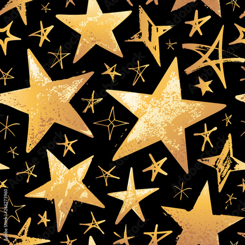 Seamless pattern with gold hand drawn vector stars isolated on black background. 