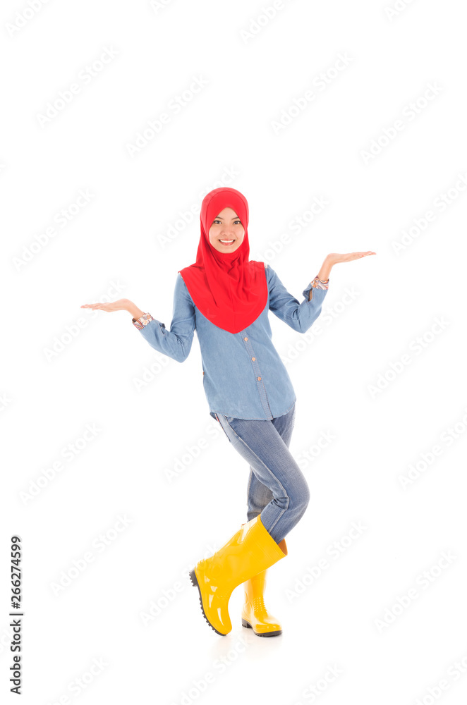 Young muslimah wearing yellow boot in pose Young muslimah wearing yellow boot in pose