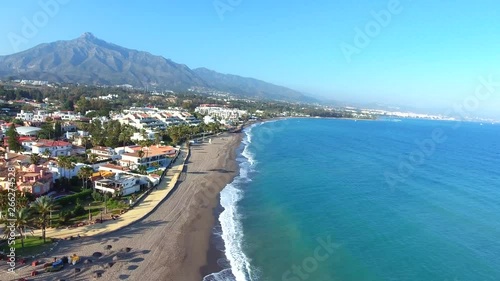 flying over marbella coastline, perfect view of beach sea and mountain (la concha). 
perfect clip for holiday vacation videos or retirement luxury life photo