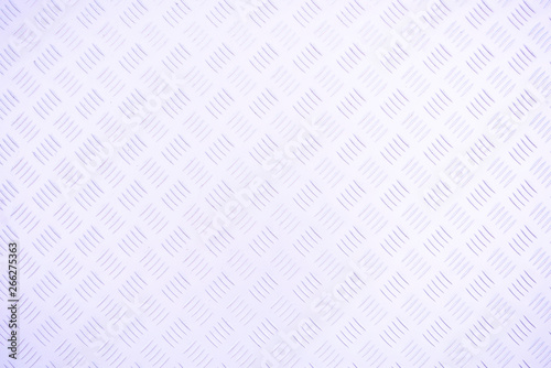 Eine helle Metallplatte mit Muster als Hintergrund