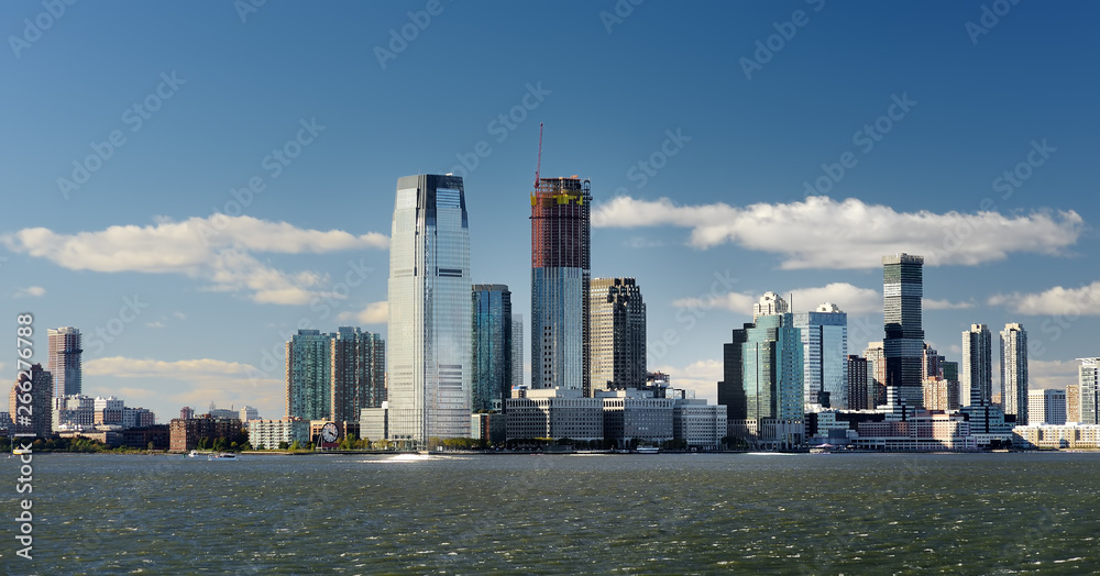 Fototapeta premium Skyline with famous skyscrapers of Manhattan and East River. Water tour to the island of Liberty.